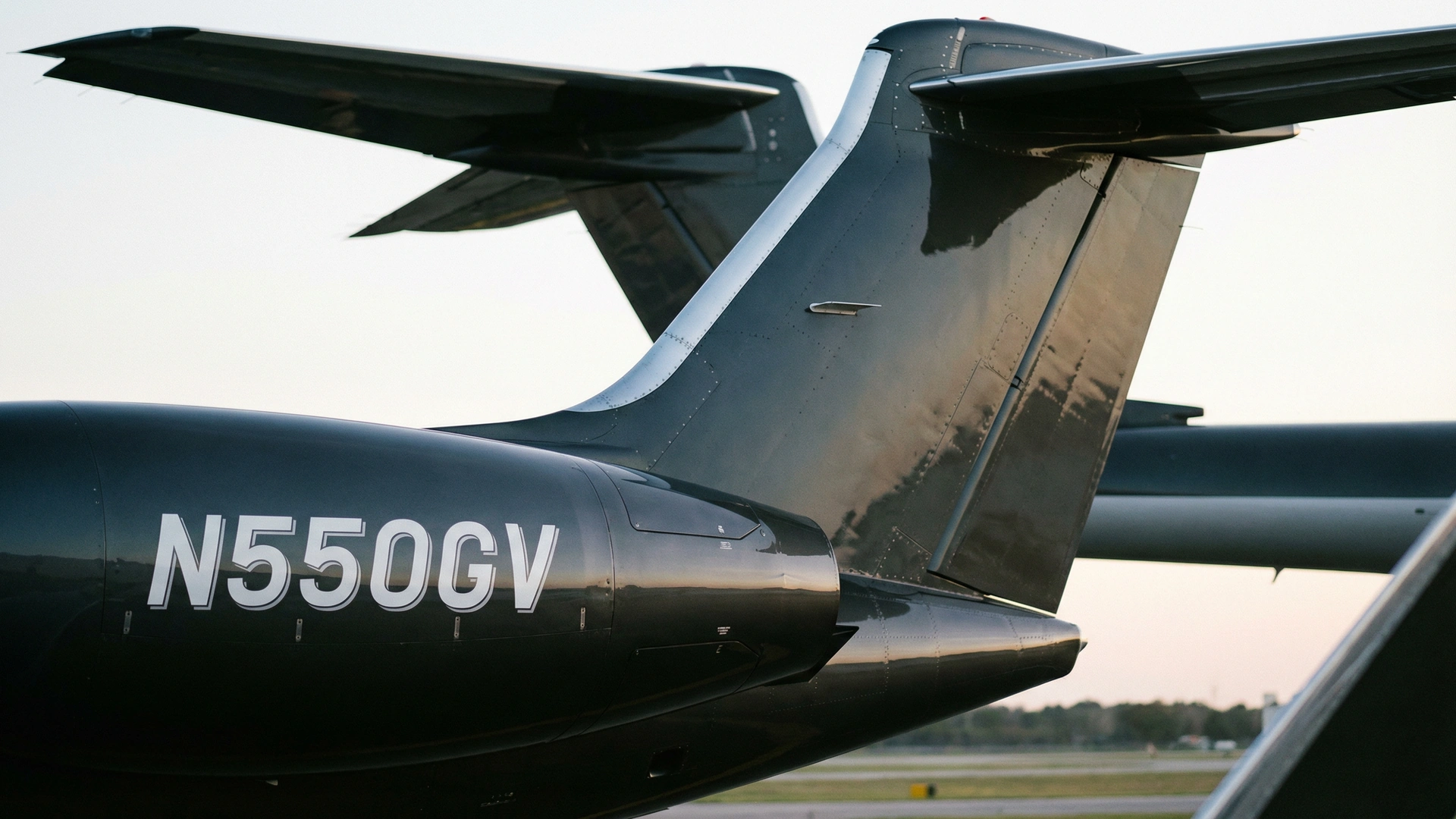 Close-up of Gulfstream G550 tail section showing aircraft registration number